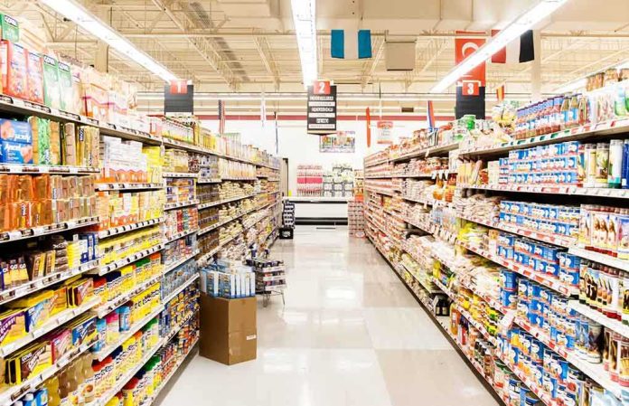 shutterstock_150161552 A grocery store aisle filled with various food products on shelves