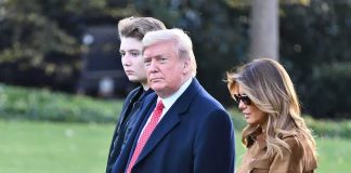 CHILLING — Iran Bounty Targets BARRON TRUMP three people walking outdoors