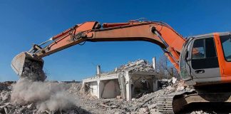 Bulldozers End ENCAMPMENT — Vanished OVERNIGHT Excavator demolishing a concrete building