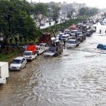 Ice Avalanche Unleashes HELL Flooded city street with stranded vehicles and traffic jam