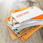 UNTHINKABLE — Prize SCAM Bleeds Veteran Dry Stack of mail with past due notice on top