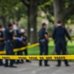 Daylight BRUTAL Killing Shocks Atlanta crime scene tape with police officers in a park