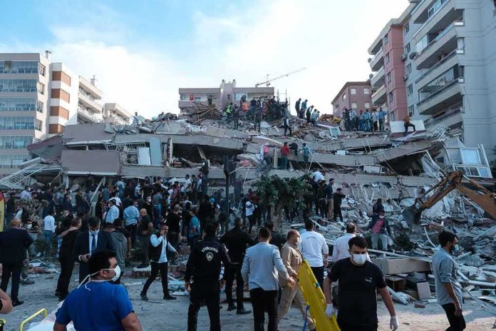 shutterstock_1845063010 Rescue workers and civilians on collapsed building after earthquake