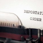 Child Marriage Defense Triggers Instant DEPORTATION Typewriter close-up with document being typed