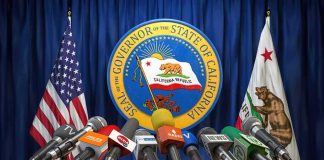 Islamic HOLIDAYS Added to State’s CLOSURE LIST Press microphones at a podium before California governor seal