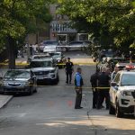 ROUTINE Stop Unmasks NIGHTMARE Passenger Police officers secure a residential street with patrol cars and yellow tape