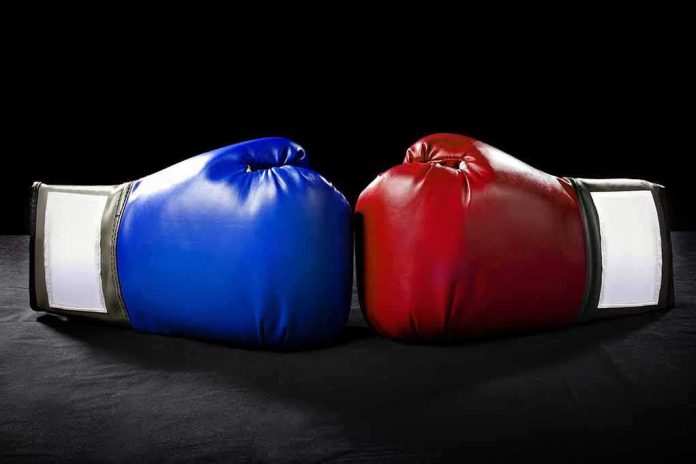 shutterstock_258411140 Blue and red boxing gloves touching together