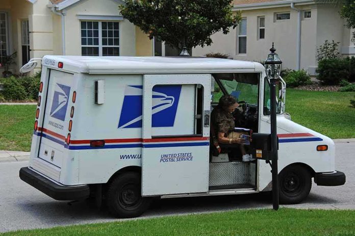 shutterstock_360666773 USPS mail truck parked at a suburban mailbox