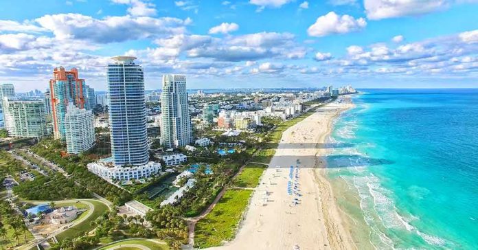 Beachfront skyline with high-rise buildings and turquoise ocean