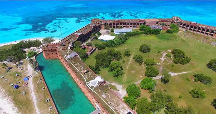 shutterstock_568086487-1 Aerial view of a coastal brick fort with moat and turquoise sea