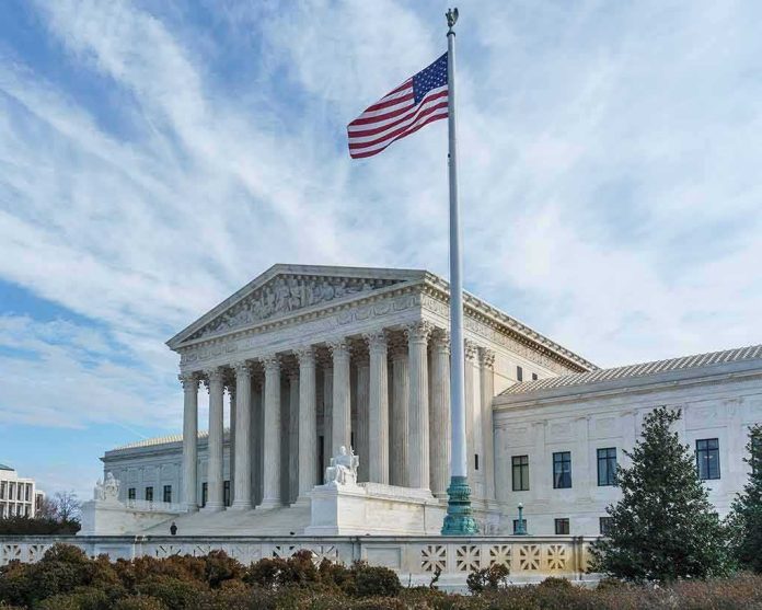 shutterstock_568824388 U.S. Supreme Court building with American flag