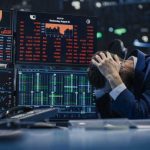 Prosecutors Eye BlackRock — Major Valuation Scandal? Trader stressed out by multiple declining stock charts.