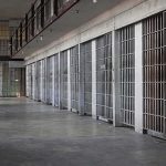 She Beat A Teen To Death. Now She Wants MERCY prison cell block with metal barred doors