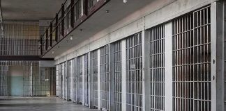 She Beat A Teen To Death. Now She Wants MERCY prison cell block with metal barred doors