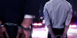 She Was On Trial For A DUI Death — Then Her LAWYER Got Cuffed Two men in handcuffs with police lights in the background
