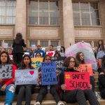 WHOA! — Nearly One In Three Wouldn’t Rule It Out Students holding protest signs on school steps