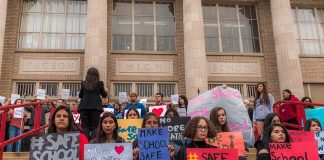 WHOA! — Nearly One In Three Wouldn’t Rule It Out Students holding protest signs on school steps