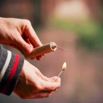 The Fireworks Video Is ONLY HALF The Story Hands lighting a firework fuse with a match