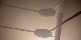 Fought For A Title, Dead A Day Later. Nobody Has Said WHY Boxing ring corner ropes in hazy light