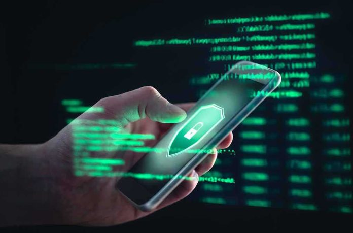 hand holding smartphone with glowing security lock icon