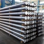 RADIATION SPEWING Missile — WHY Pentagon Walked Away Stacked metal rods on pallets in an industrial warehouse