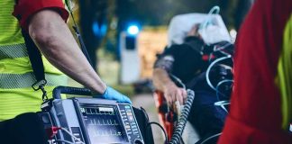 VACATION Ride Turns Into HORROR Paramedic with defibrillator beside patient on stretcher