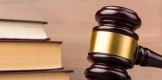 A Reporter Died In His Hotel Room — A Jury Just Ruled On The WOMAN Judge's gavel with gold band beside stacked law books