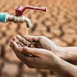 The Whole Base Lost Its Water — Then It Came Back The Wrong COLOR Hands catching drops from a faucet over parched ground