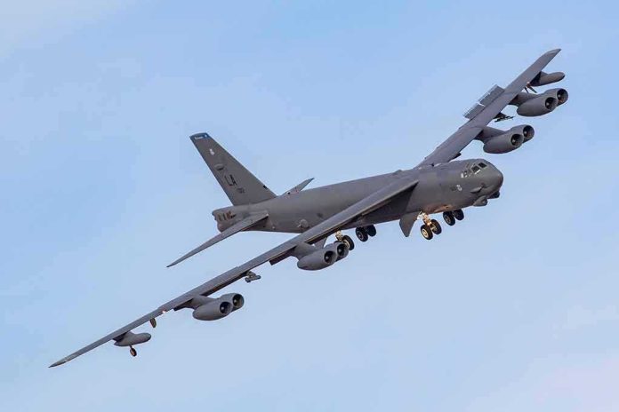 shutterstock_1691982994 Military bomber aircraft banking in flight