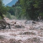 Raging Wall Of Water TRAPS HIKERS Flooded river gorge with fast muddy water and rocks