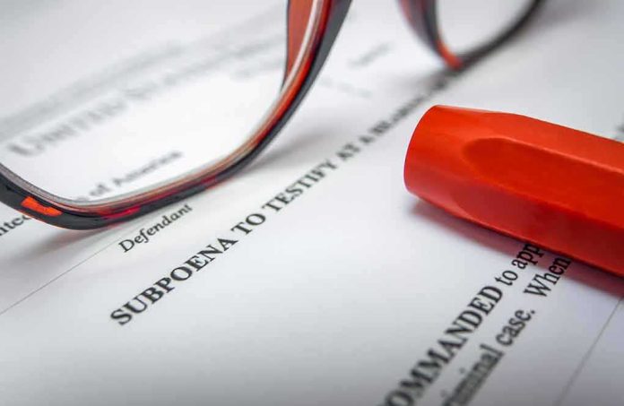 shutterstock_1743564812 Subpoena document with red highlighter and eyeglasses