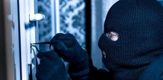 Singer Said A Burglar Shot His Wife — Then Came His TEXTS Masked person picking a door lock