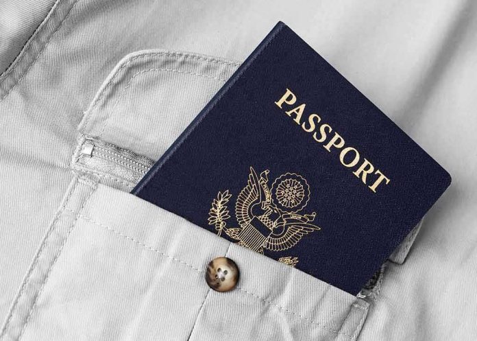 shutterstock_175557515 Passport in shirt pocket