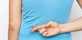 Fake Pregnancy BOMBSHELL Shocks Court Person with crossed fingers behind their back