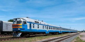 206 On Board When The Drone Hit — The Crew Had SECONDS Blue and white passenger train on railway tracks