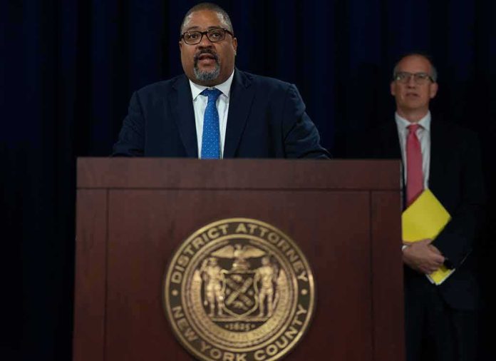Man speaks at podium with New York County District Attorney seal