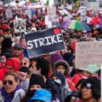 Showdown In L.A.: Mayor Blocks Feds Chuck Howley and Christian Jones in a large protest crowd holding strike signs