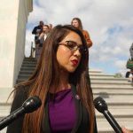 Boebert Called The Complaint A Lie — Then Came The Paper TRAIL Woman speaking to microphones on stone steps
