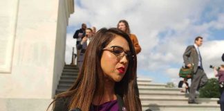 Boebert Called The Complaint A Lie — Then Came The Paper TRAIL Woman speaking to microphones on stone steps