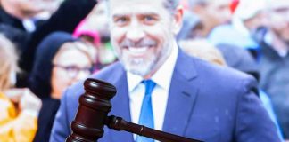 Hunter’s LATEST Bid For ATTENTION judge's gavel on desk with blurred suited man in background