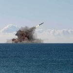 Oil Lifeline Hit — Tehran VOWS PAYBACK Missile launching over the sea with smoke plume