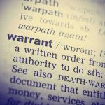 $189M Prison Tablet Scandal: Shocking Abuse Exposed Dictionary entry for the word warrant in close-up