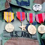 Six Dead, One Leader Runs Into Flames Military uniform with service medals and ribbons