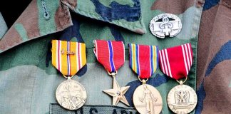 Six Dead, One Leader Runs Into Flames Military uniform with service medals and ribbons