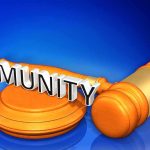 Jailed Strongman Plays “President” Card Judge's gavel with the word Immunity across it