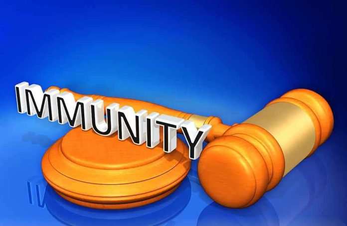 shutterstock_620996042 Judge's gavel with the word Immunity across it