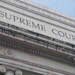 Supreme Court To Decide What COUNTS As HELPING Supreme Court building facade with classical columns