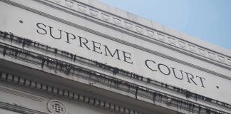 Supreme Court To Decide What COUNTS As HELPING Supreme Court building facade with classical columns