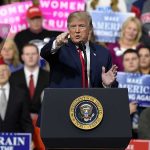 Trump’s Newly Launched Project READS Like Science Fiction Donald Trump speaking at a rally podium, pointing toward the audience