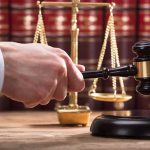 Her RAGE Killed A Dad-To-Be. The Jury Didn’t Wait LONG Judge's hand holding gavel near scales of justice